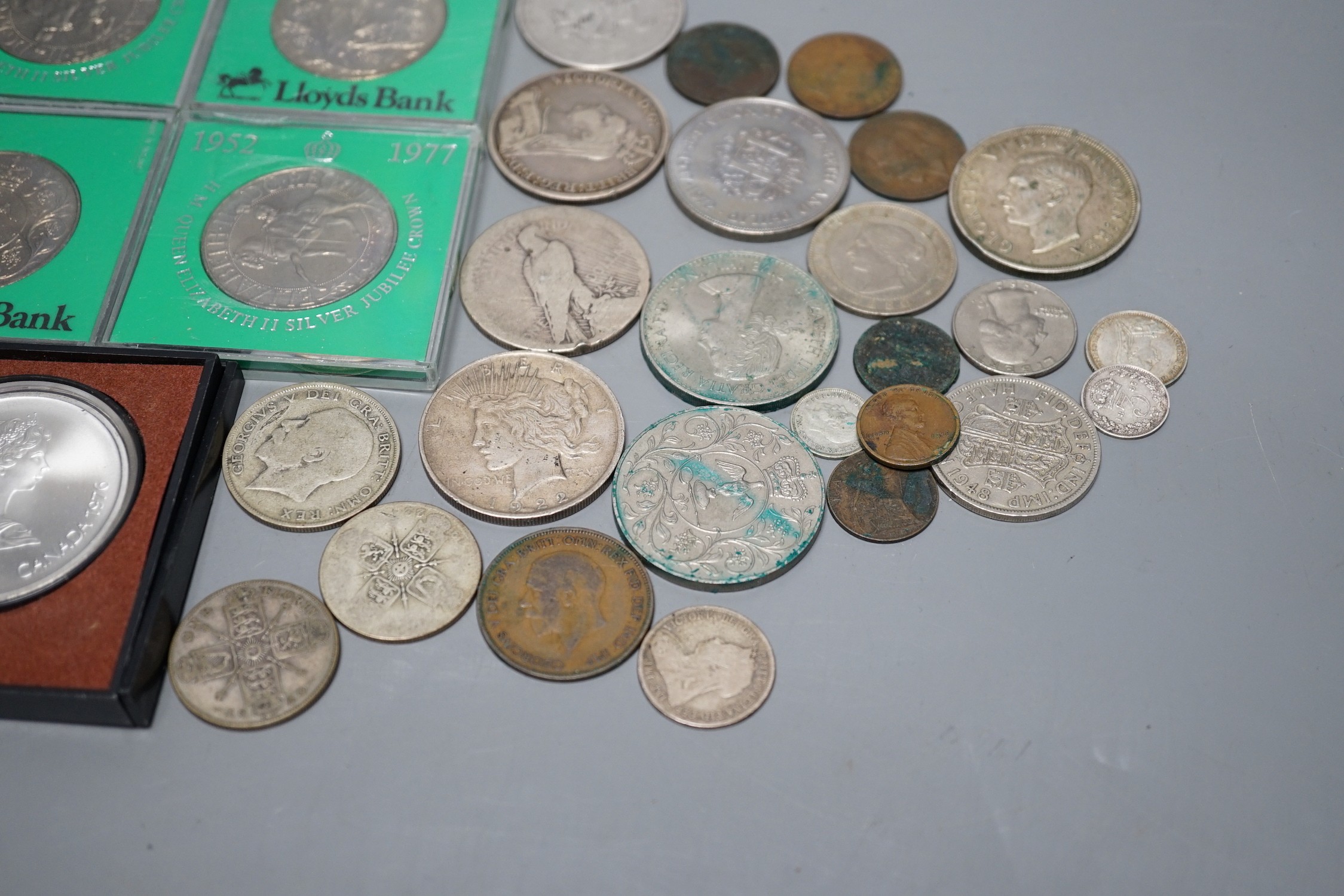 A group of mostly UK crowns and other coins, some pre-1920 silver coins and a 1976 Montréal Olympics commemorative silver coin